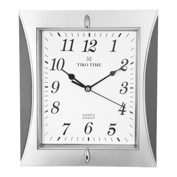 Téglalap formájú,  ezüst-szürke színű, analóg falióra műanyag tokban, fehér számlap, minőségi quartz szerkezettel